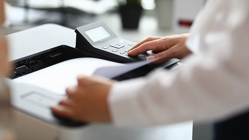 Man using a wireless printer